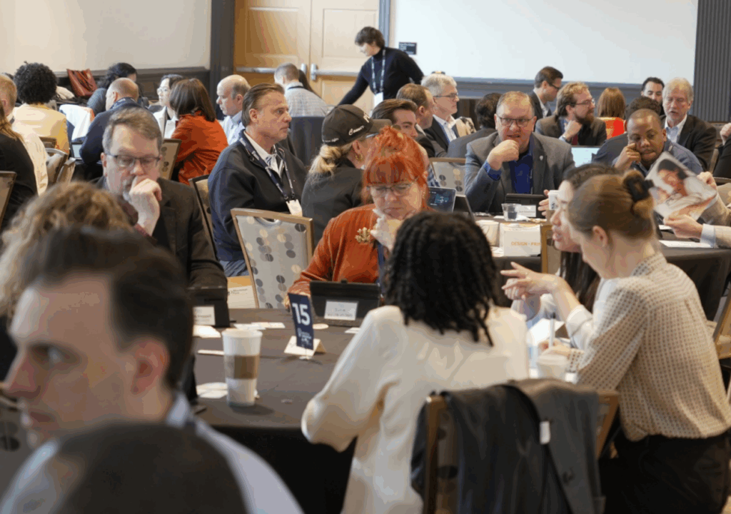 people at round tables at pitch event